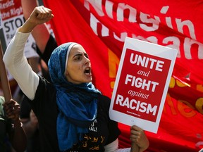 A woman shouts slogans as people march in support of the Muslim community as activists take part in the 'March Against Sharia' at Foley Square on June 10, 2017 in New York.