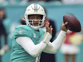 Miami Dolphins quarterback Tua Tagovailoa looks to pass during the first half of an NFL football game against the Green Bay Packers, Sunday, Dec. 25, 2022, in Miami Gardens, Fla.