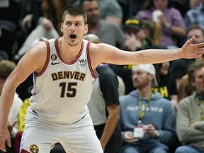 Nuggets centre Nikola Jokic defends against the Jazz during second half NBA action in Salt Lake City, Saturday, April 8, 2023.