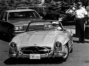 Former Prime Minister Pierre Trudeau gets a final slaute from RCMP guard as he leaves 24 Sussex Dr. June 30, 1984 after resigning as prime minister. Trudeau drove his Mercedes sports car to Harrington Lake for the weekend.