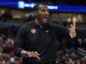 Pistons head coach Dwane Casey talks to his team during the first half of an NBA game against the Bulls in Chicago, Sunday, April 9, 2023.
