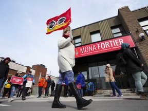 PSAC workers and supporters picket in front of President of the Treasury Board Mona Fortier's office in Ottawa on Friday, April 21, 2023.