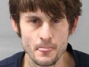 Gill Babich, 35, of Toronto, is wanted for allegedly robbing an elderly woman at knifepoint at a downtown Toronto ATM on Friday, April 28, 2023.