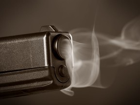A smoking semi-automatic pistol.