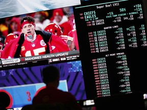A person gambles as betting odds for NFL football's Super Bowl are displayed on monitors at the Circa resort and casino sports book in Las Vegas, Friday, Feb. 3, 2023. The first year of legal single-game sports betting in Ontario has been a whirlwind for NorthStar Gaming CEO Michael Moskowitz.