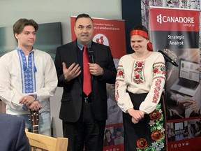 Ukrainian students Rodi (left) and sister Veronika Rohachevska (right) are introduced by Canadore College VP Shawn Chorney at the President's Dinner on Friday, April April 14, 2023. The talented and brave siblings were given a scholarship from the war zone to study in North Bay.