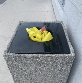 The remnants of police tape at a Mississauga plaza after a stabbing the day before is seen on Thursday, April 20, 2022. Joe Warmington/Toronto Sun