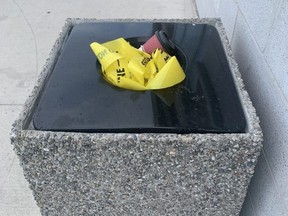 The remnants of police tape at a Mississauga plaza after a stabbing the day before is seen on Thursday, April 20, 2022. Joe Warmington/Toronto Sun