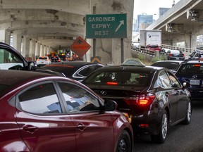Cars line up for the ramp to the Gardiner Expressway at Lower Jarvis St. and Lake Shore Blvd. E. during the afternoon rush hour in Toronto, Ont. on Thursday October 6, 2022.