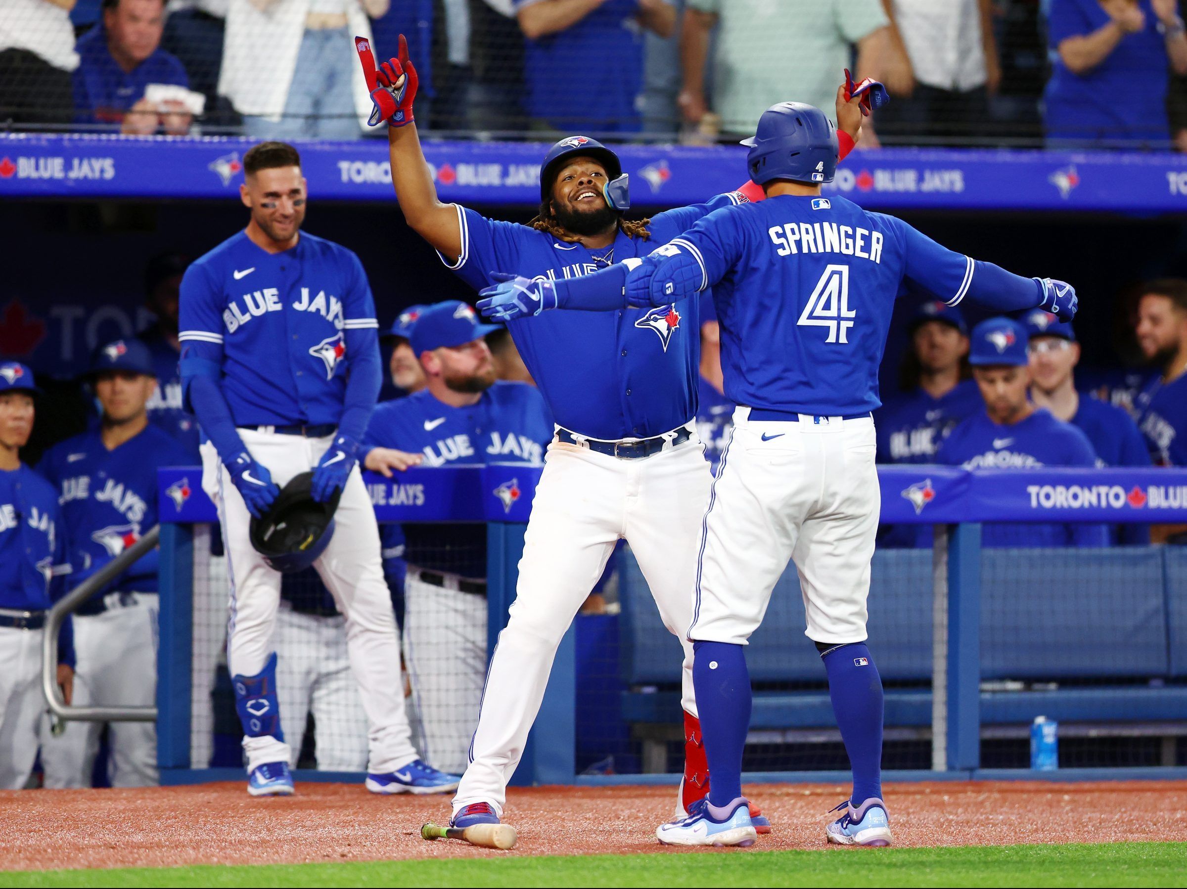 Blue Jays spoil Rangers home opener before largest MLB crowd