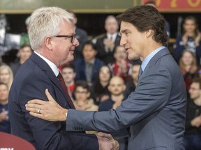 Frank Blome, the CEO of PowerCo., VW’s battery-making subsidiary, greets Prime Minister Justin Trudeau Friday, April 21, 2023,  during the official announcement of the company's new plant in St. Thomas, Ont.
