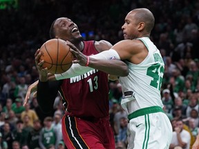 Miami Heat centre Bam Adebayo (13) is fouled by Boston Celtics centre Al Horford.