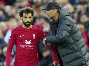 Jurgen Klopp gives instructions to Mohamed Salah.