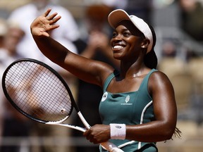 Sloane Stephens celebrates winning a match.