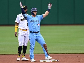 Toronto Blue Jays left fielder Daulton Varsho reacts after hitting a double during the first inning against the Pittsburgh Pirates.