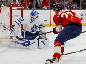 Toronto Maple Leafs goaltender Joseph Woll makes a save after a shot from Florida Panthers centre Eetu Luostarinen on Sunday.