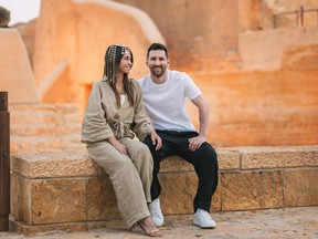 This handout picture provided by the Saudi Tourism Authority shows Argentine forward Lionel Messi, his wife Antonela Roccuzzo visiting Diriyah near Riyadh.