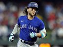 Bo Bichette of the Toronto Blue Jays rounds bases after hitting a solo home run against the Philadelphia Phillies.