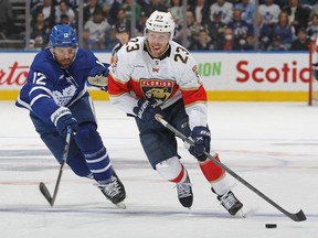 Carter Verhaeghe of the Florida Panthers skates with the puck against Zach Aston-Reese of the Toronto Maple Leafs during Game One of the Second Round of the 2023 Stanley Cup Playoffs at Scotiabank Arena on May 2, 2023 in Toronto, Ontario, Canada.