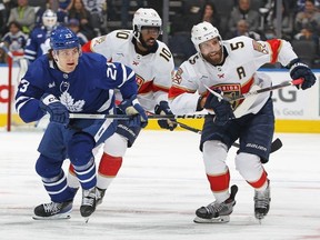 Aaron Ekblad of the Florida Panthers and teammate Anthony Duclair skate against Matthew Knies of the Toronto Maple Leafs during Game One of the Second Round of the 2023 Stanley Cup Playoffs at Scotiabank Arena on May 2, 2023 in Toronto, Canada.