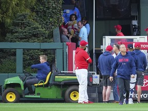 Medical staff tend to a fan who fell into the bullpen in the top of the first inning of the game during the game between the Boston Red Sox and Philadelphia Phillies at Citizens Bank Park on Friday night.
