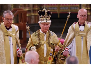 King Charles III stands after being crowned during his coronation ceremony in Westminster Abbey, on May 6, 2023 in London.