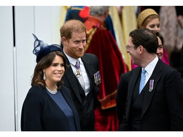 Prince Harry, Duke of Sussex, Princess Eugenie and her husband Jack Brooksbank leave Westminster Abbey following the Coronation of King Charles III and Queen Camilla on May 6, 2023 in London.