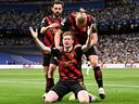 Manchester City's Kevin De Bruyne celebrates with teammates scoring his team's first goal during the UEFA Champions League semifinal against Real Madrid CF.