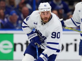Ryan O'Reilly of the Toronto Maple Leafs looks to pass the puck.