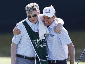 Steven Alker of New Zealand, right, hugs his son Ben Alker after winning the Insperity Invitational at The Woodlands Golf Club on April 30, 2023 in The Woodlands, Texas. (Photo by Tim Heitman/Getty Images)