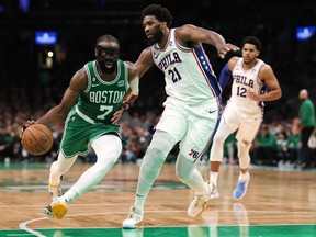 Joel Embiid #21 of the Philadelphia 76ers defends Jaylen Brown #7 of the Boston Celtics during the second half of game two of the Eastern Conference Second Round Playoffs at TD Garden on May 03, 2023 in Boston, Massachusetts. The Celtics defeat the 76ers 121-87.