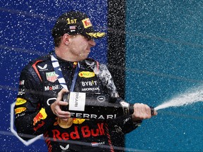 Race winner Max Verstappen of the Netherlands and Oracle Red Bull Racing celebrates on the podium during the F1 Grand Prix of Miami at Miami International Autodrome on May 07, 2023 in Miami.