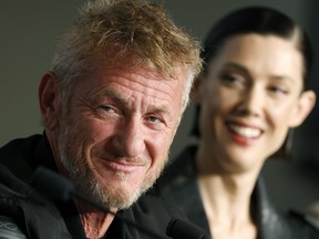 Sean Penn and Raquel Nave attend the "Black Flies" press conference at the 76th annual Cannes film festival at Palais des Festivals on May 19, 2023 in Cannes, France.
