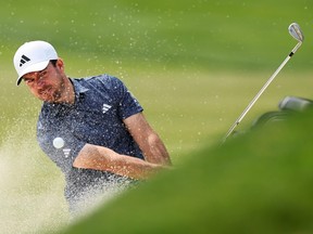Nick Taylor of Canada plays a shot from a bunker on the fourth hole during a practice round prior to the 2023 PGA Championship.