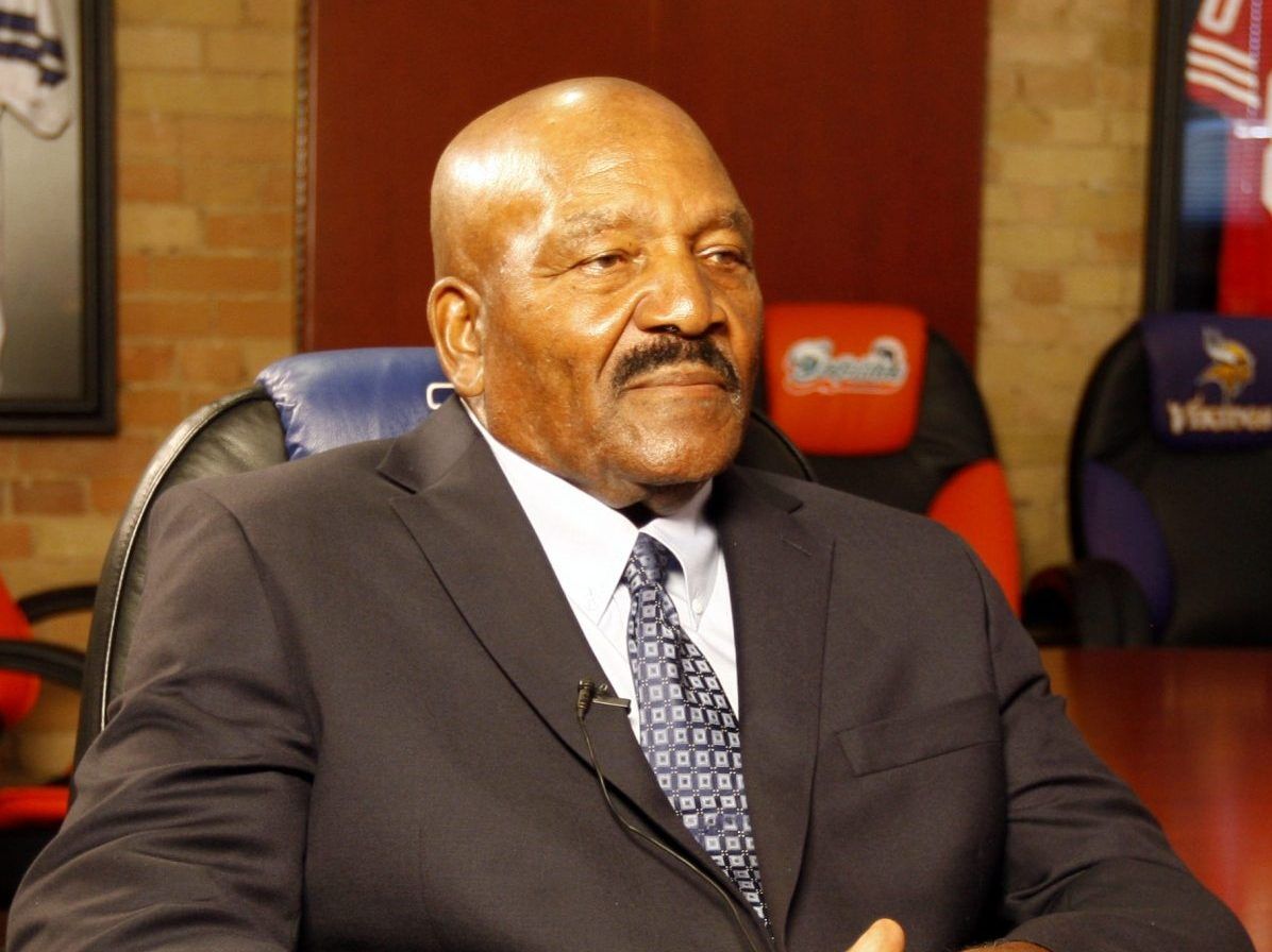 Jim Brown of the Cleveland Browns look on from the sidelines during