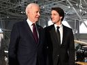 US President Joe Biden and Canada's Prime Minister Justin Trudeau arrive to attend a gala dinner at the Canadian Aviation and Space Museum in Ottawa, Canada, on March 24, 2023. 