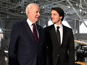 U.S. President Joe Biden and Canada's Prime Minister Justin Trudeau arrive for a gala dinner at the Canadian Aviation and Space Museum March 24, 2023 in Ottawa, Canada.