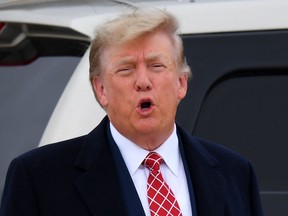 Former US President Donald Trump speaks to members of the media on the tarmac after disembarking "Trump Force One" at Aberdeen airport on the north-east coast of Scotland on May 1, 2023, at the start of his first visit to the country since losing the presidency.