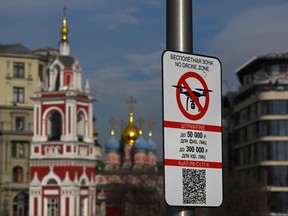 In this file photo taken on March 15, 2023 a "No Drone Zone" sign sits in central Moscow as it prohibits unmanned aerial vehicles (drones) flying over the area.