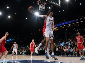 Metropolitan 92's French power forward Victor Wembanyama (C) fights for the ball during the French Elite basketball match between Boulogne-Levallois Metropolitans 92 and Bourg-en-Bresse at The AccorHotels Arena in Paris on May 7, 2023.