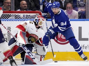 Toronto Maple Leafs centre Auston Matthews (34) handles the puck behind the net as Florida Panthers goaltender Sergei Bobrovsky (72) looks on during first period, second round, game one, NHL Stanley Cup hockey action in Toronto, Tuesday, May 2, 2023. THE CANADIAN PRESS/Frank Gunn