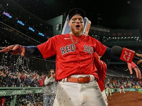 Boston Red Sox right fielder Alex Verdugo (99) is doused with water after hitting a walk off home run against the Toronto Blue Jays during the ninth inning at Fenway Park on May 1, 2023.