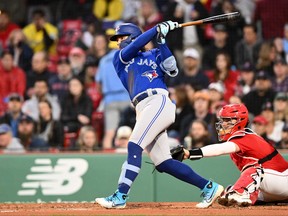 May 1, 2023; Boston, Massachusetts, USA; Toronto Blue Jays shortstop Bo Bichette (11) hits a three run home run against the Boston Red Sox during the second inning at Fenway Park.