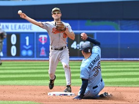 Baltimore Orioles second baseman Adam Fraizier throws to first base for a double play after forcing out Toronto Blue Jays centre fielder Kevin Kiermaier in the fourth inning at Rogers Centre in Toronto, May 21, 2023.