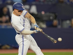 Apr 30, 2023; Toronto, Ontario, CAN; Toronto Blue Jays third baseman Matt Chapman (26) hits two run RBI double against the Seattle Mariners during the first inning at Rogers Centre.