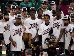 The Miami Heat celebrate on the podium after defeating the Boston Celtics