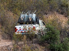 A Portugal Emergency Services vehicle carries wheelbarrows