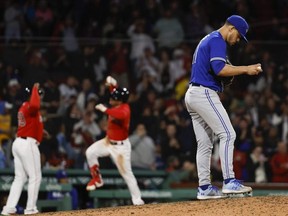 Blue Jays pitcher Jose Berrios walks back up the mound after giving up a two-run homer to Boston s Enmanuel Valdez at Fenway Park Monday night. Getty Images