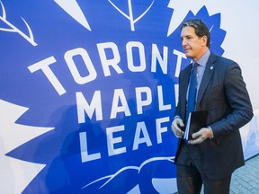 Toronto Maple Leafs president Brendan Shanahan walks past the teams' logo