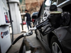 A fuel pump is seen in a car at a gas station in Toronto on April 22, 2014.